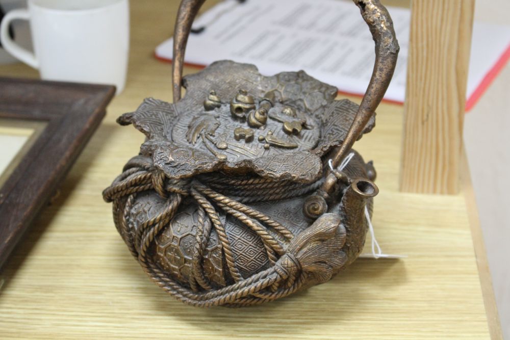 A Chinese iron teapot and cover, height 16cm